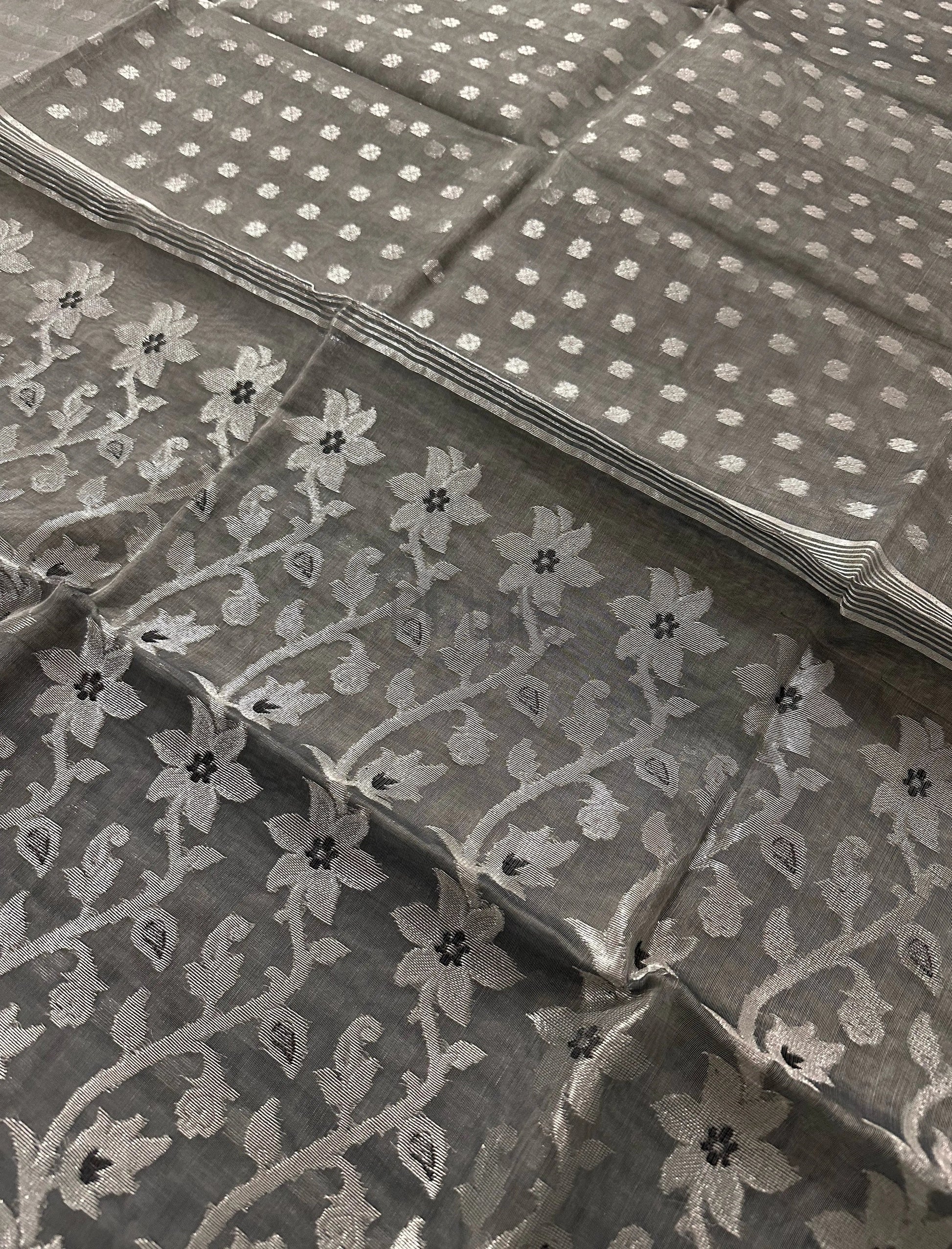 Handwoven ash colour Muslin saree with silver zari work and black meena Putul's Fashion