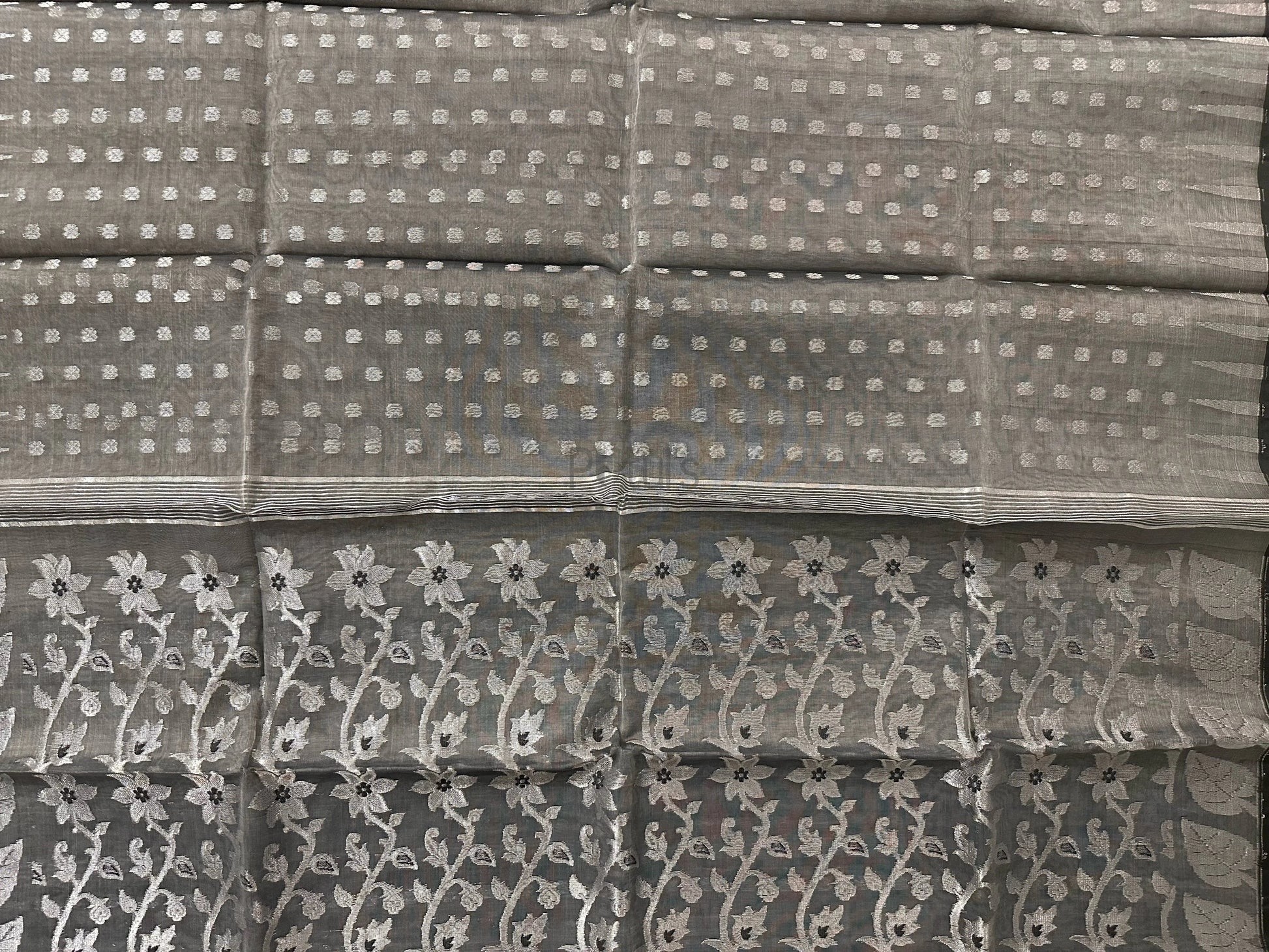 Handwoven ash colour Muslin saree with silver zari work and black meena Putul's Fashion