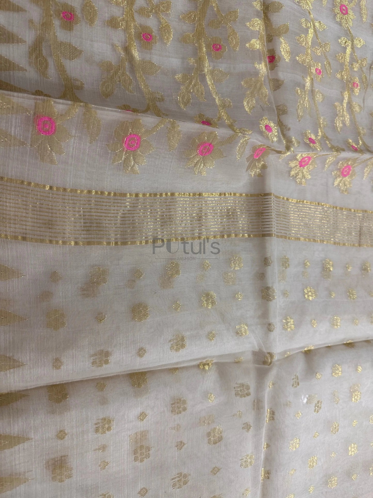 white coloured Muslin saree with pink minakari Putul's Fashion