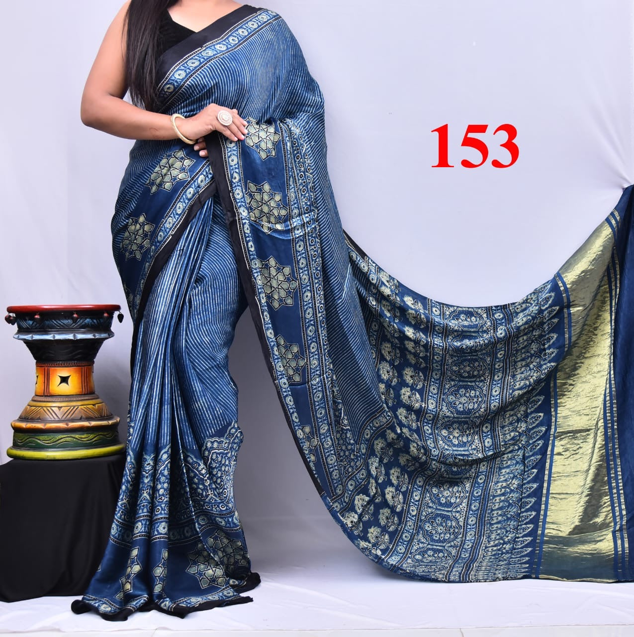 Natural dyed Modal silk saree with ajrakh print and lagdi patta on pallu