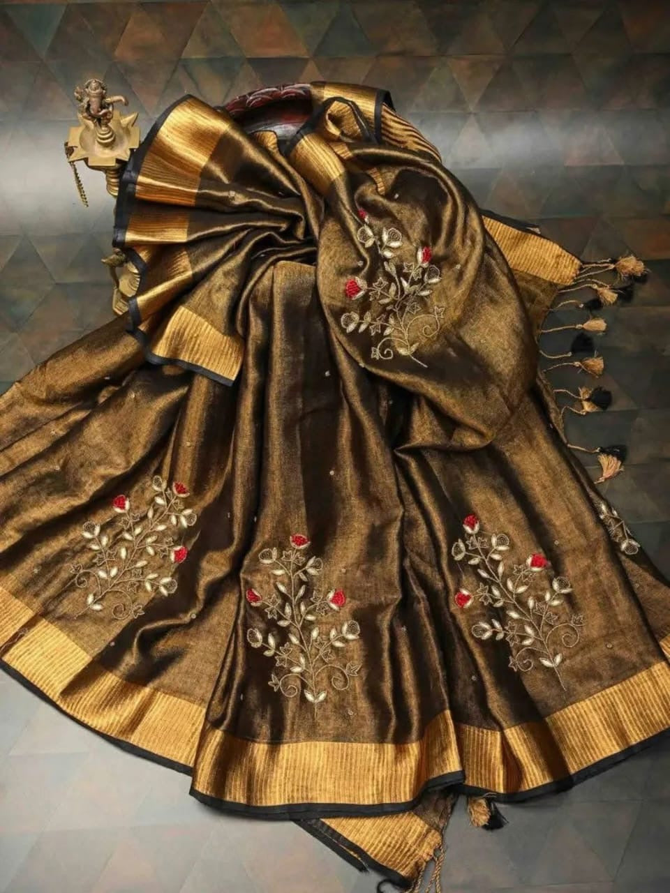Elegant tissue Linen Jamdani Saree with hand French embroidery work from Putul's Fashion Collection