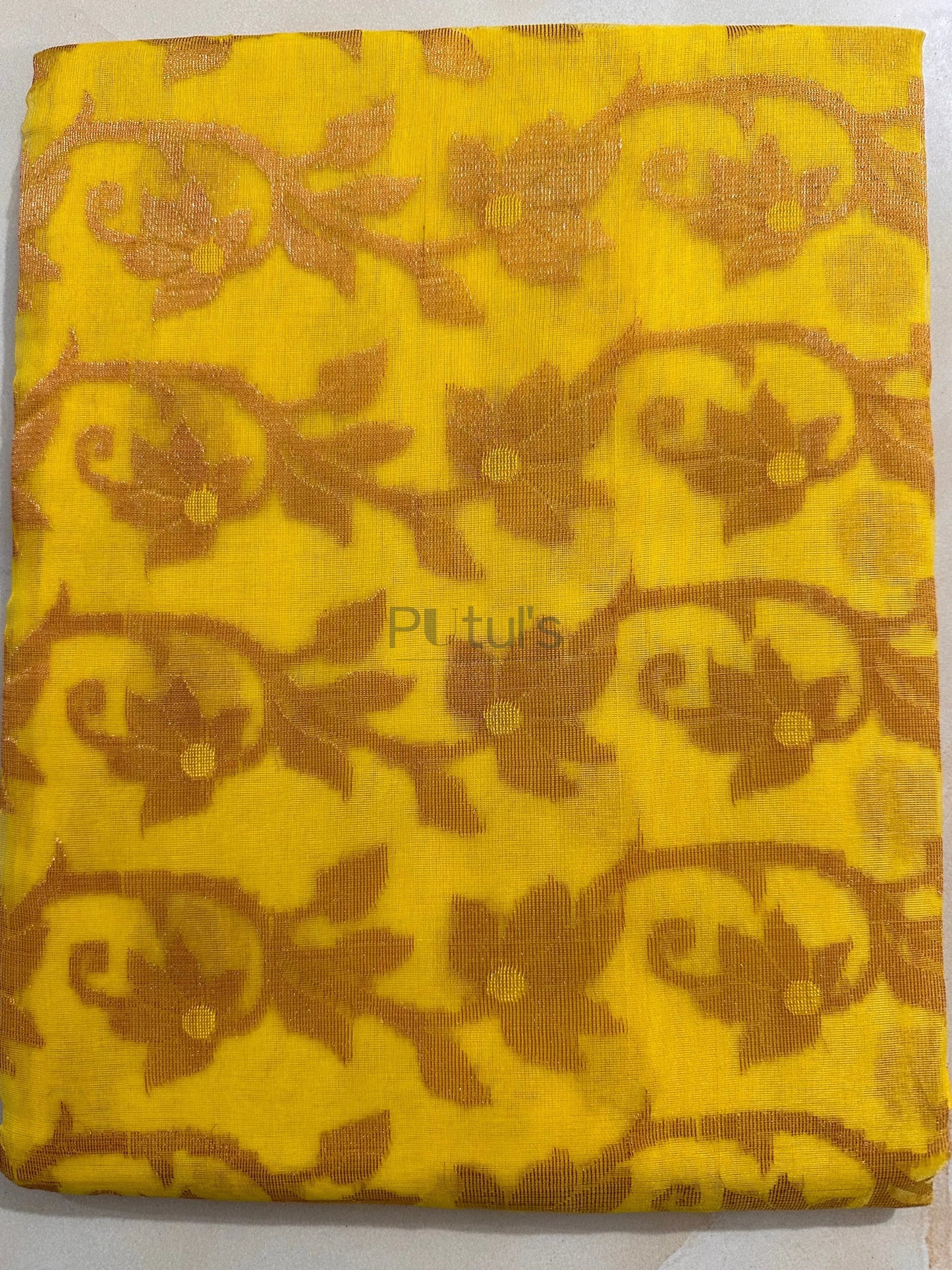 Yellow coloured Muslin saree of golden meenakari work Putul's Fashion