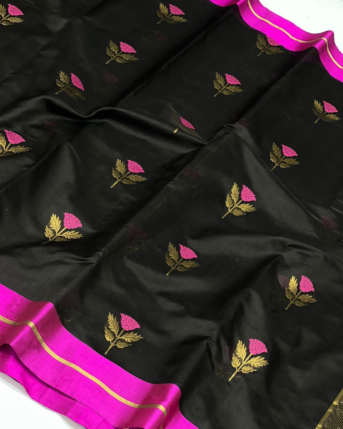 Black coloured pattu silk enriched with rich hand weave minakari work