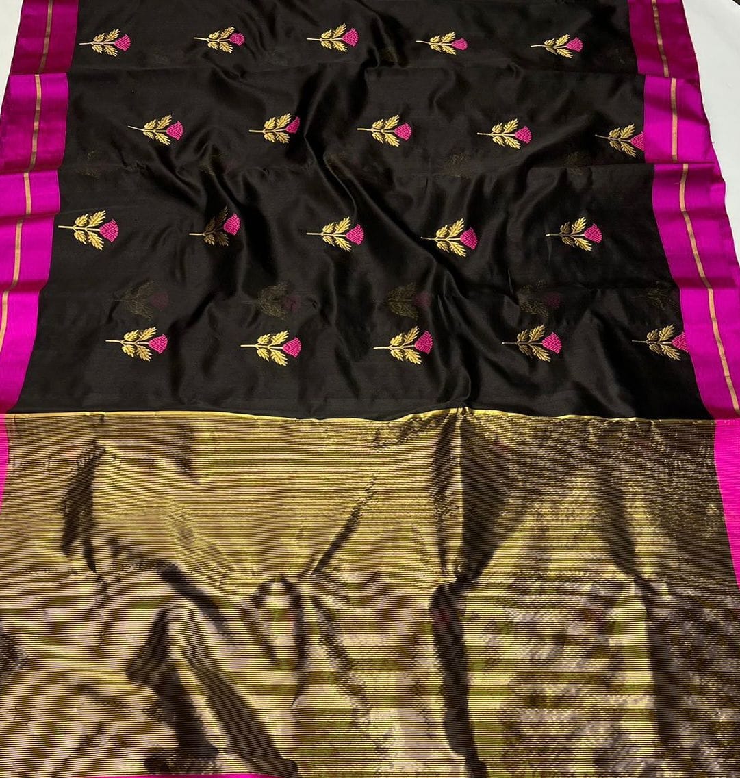 Black coloured pattu silk enriched with rich hand weave minakari work