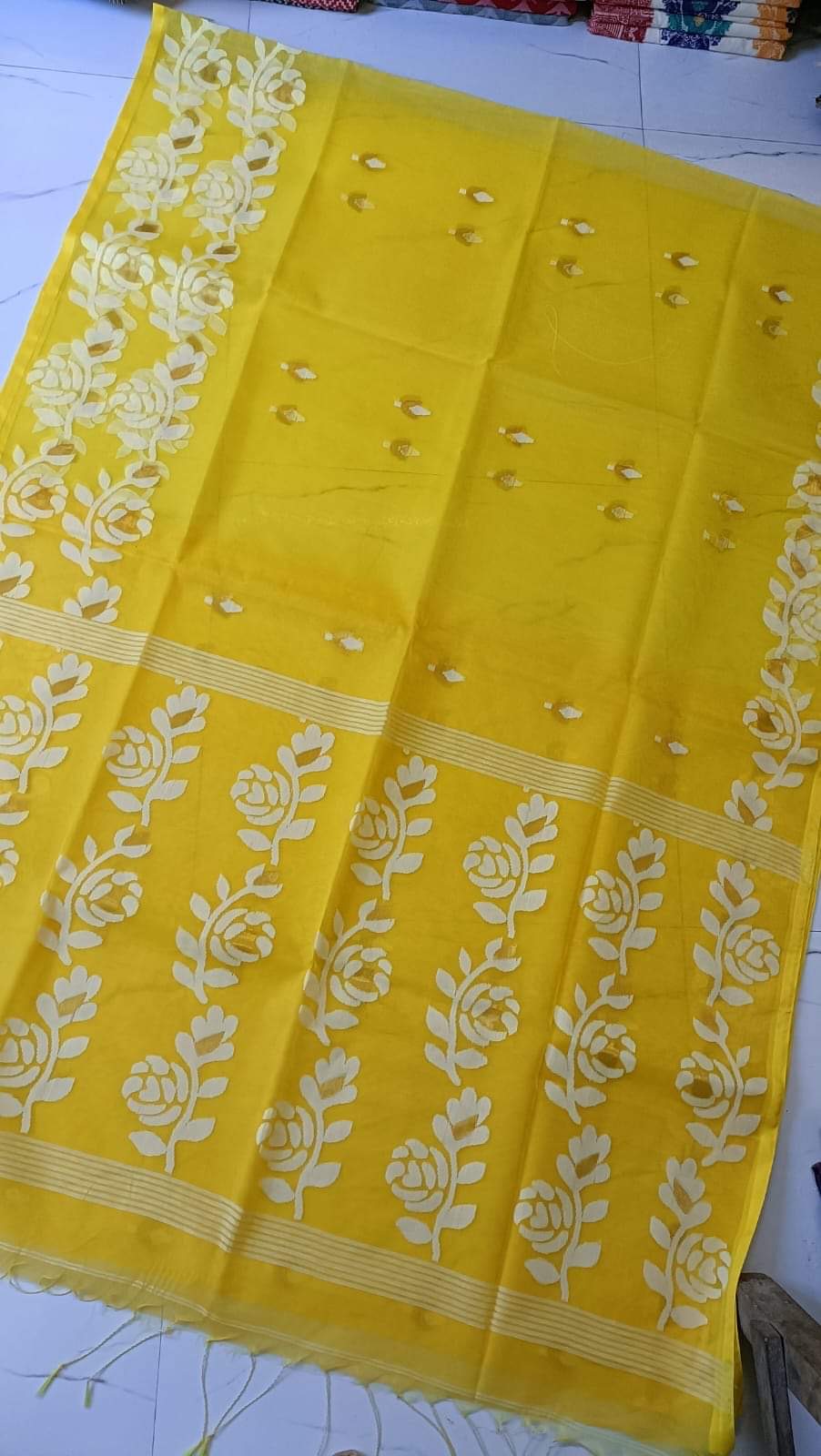 Bright yellow Muslin jamdani saree