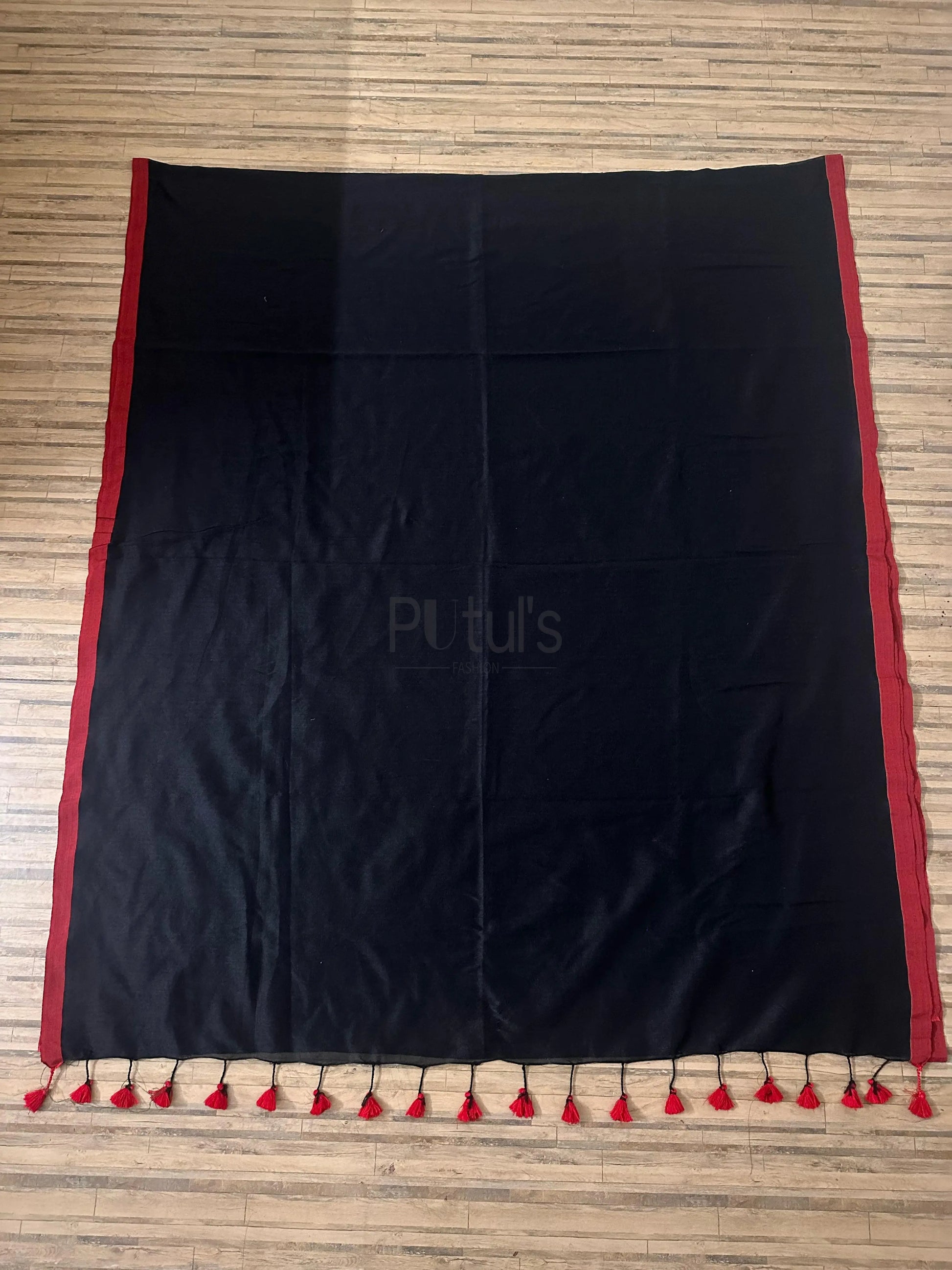 Black coloured mul cotton saree with red border and red tassel Putul's Fashion
