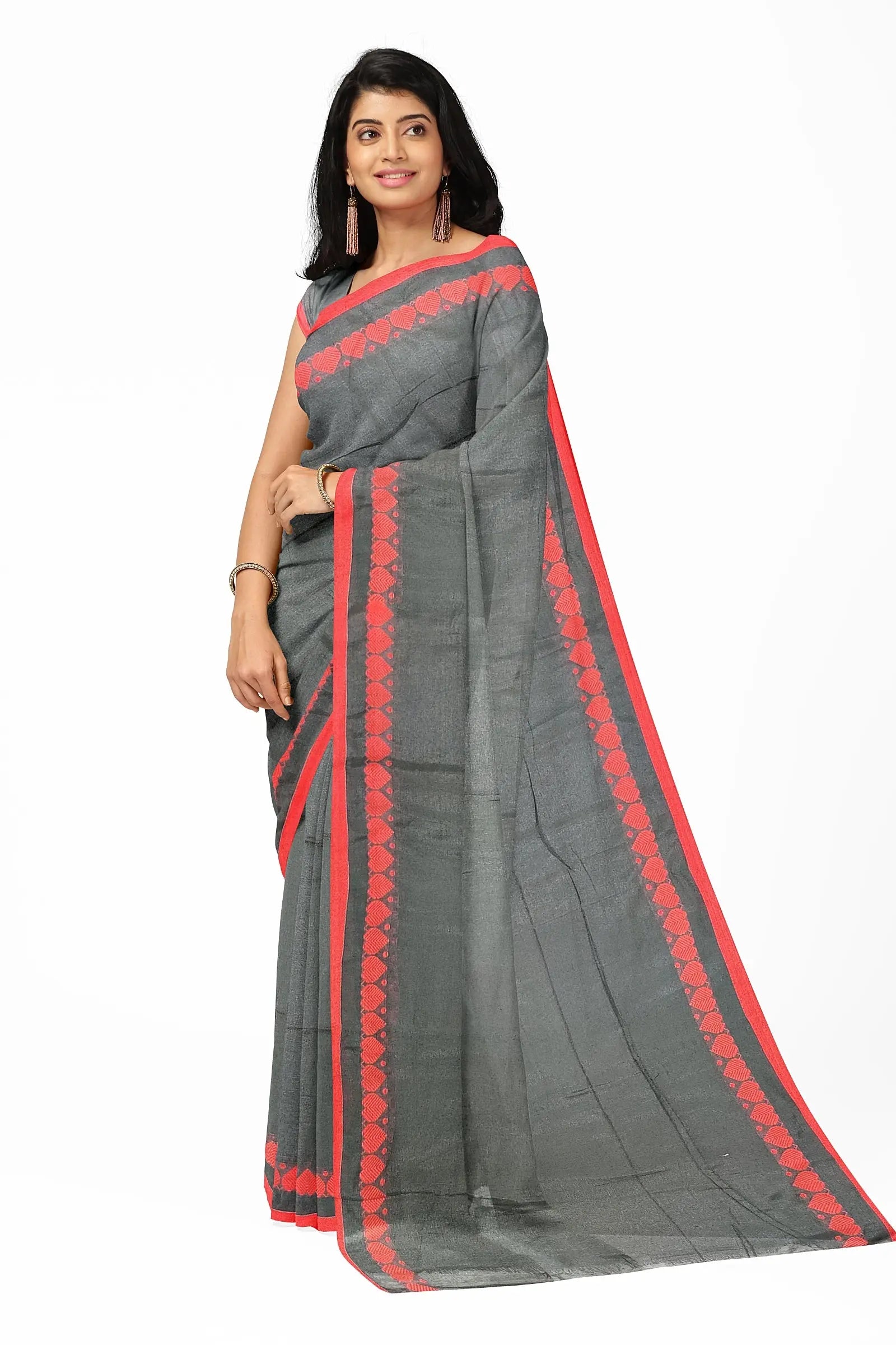 The saree is a beautiful shade of black. The love weaving pattern is made up of small, intricate hearts. The saree is made of 100% cotton. The saree is soft and comfortable to wear. The saree is perfect for a formal or informal event. Putul's fashion