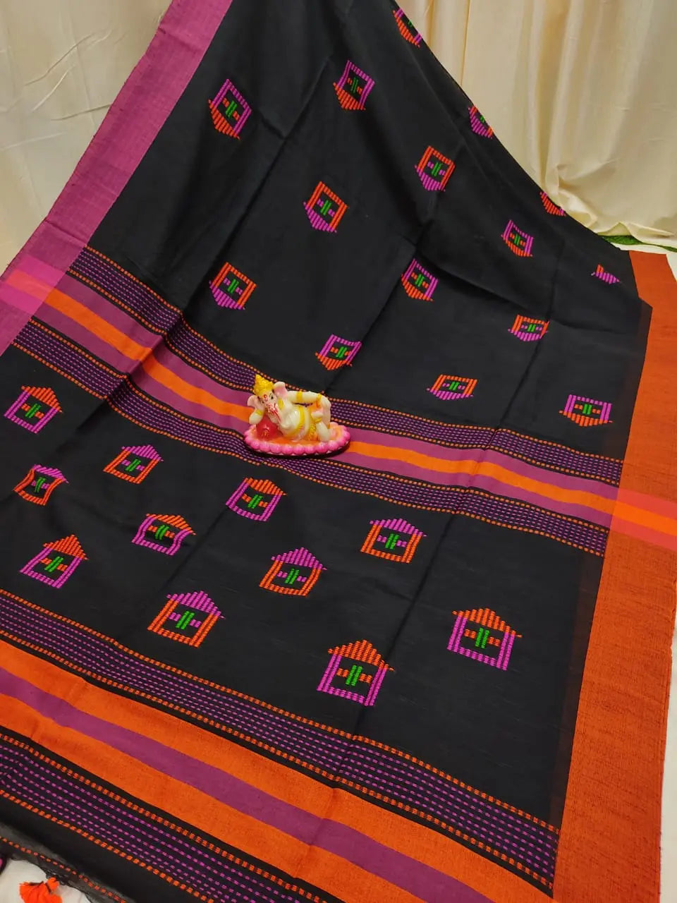 Black cotton saree with running blouse house motif all over the saree