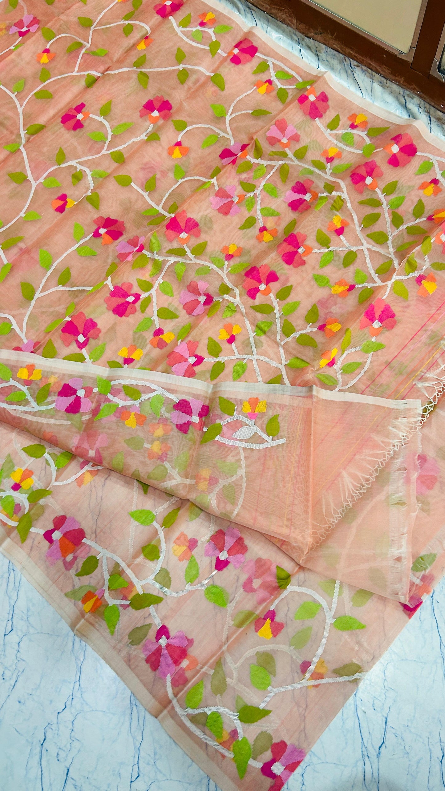 Peach Floral Muslin Jamdani Saree by Putul’s Fashion
