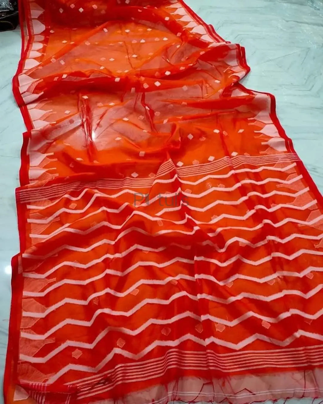 Handwoven pure white coloured Muslin saree Putul's Fashion